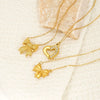Wholesale Women's 18K Goldplated Heart Shape Bow Pendant Cross Chain Necklace Made Of Titanium Steel