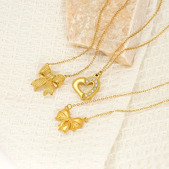 Wholesale Women's 18K Goldplated Heart Shape Bow Pendant Cross Chain Necklace Made Of Titanium Steel
