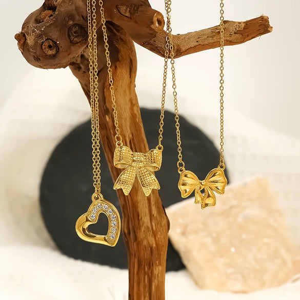 Wholesale Women's 18K Goldplated Heart Shape Bow Pendant Cross Chain Necklace Made Of Titanium Steel