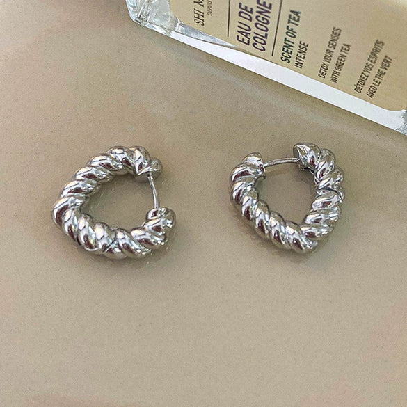 Wholesale Women's Light Luxury Alloy Heart Twist Love Earrings With Gold Plating Electroplating