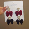 Wholesale Women's Light Luxury Flocking Bow And Heart Zinc Alloy Earrings With Electroplating Treatment