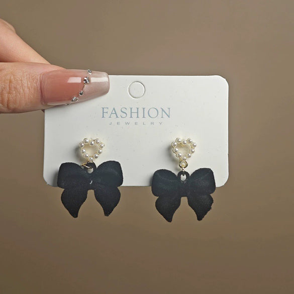 Wholesale Women's Light Luxury Flocking Bow And Heart Zinc Alloy Earrings With Electroplating Treatment