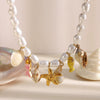 Wholesale Women's Light Luxury Geometric Stainless Steel Electroplated 18K Gold Baroque Imitation Pearl Starfish Shell Necklace