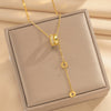 Wholesale Women's Light Luxury Geometric Titanium Steel Cross Chain Necklace With Copper Inlaid Zircon Pendant And Real Gold Plating