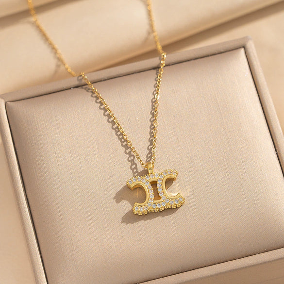 Wholesale Women's Light Luxury Gold Plated Arc De Triomphe Pendant Necklace With Copper Inlaid Zircon And Titanium Steel O Word Chain