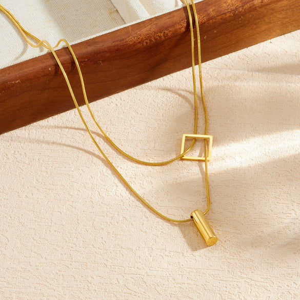 Wholesale Women's Light Luxury Goldplated Stainless Steel Geometric Snake Bone Chain Necklace With Square And Cylindrical Pendant