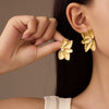 Wholesale Women's Light Luxury Highend Stainless Steel And Titanium Steel Earrings With Geometric Flowers And Pearl Design Electroplated