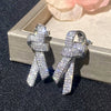 Wholesale Women's Light Luxury Style Copper Earrings With Microinlaid Zircon And Bow Tie Geometric Design