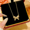 Wholesale Women's Light Luxury Titanium Steel Oshaped Chain Necklace With Copper Pendant Inlaid With Zircon In Bowknot Shape