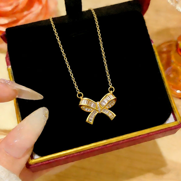 Wholesale Women's Light Luxury Titanium Steel Oshaped Chain Necklace With Copper Pendant Inlaid With Zircon In Bowknot Shape