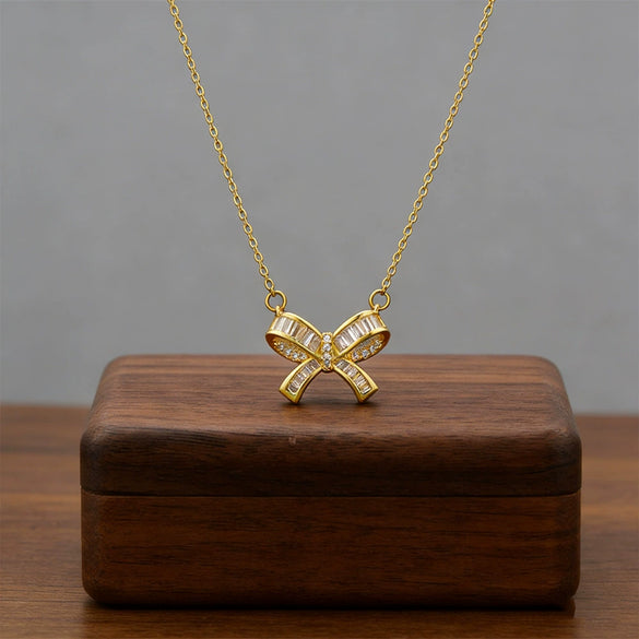 Wholesale Women's Light Luxury Titanium Steel Oshaped Chain Necklace With Copper Pendant Inlaid With Zircon In Bowknot Shape