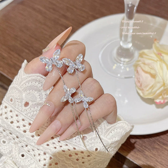 Wholesale Women's Light Luxury Ultraflash Long Copper Zircon Butterfly Tassel Earrings With Bow And Geometric Patterns And Animal Style