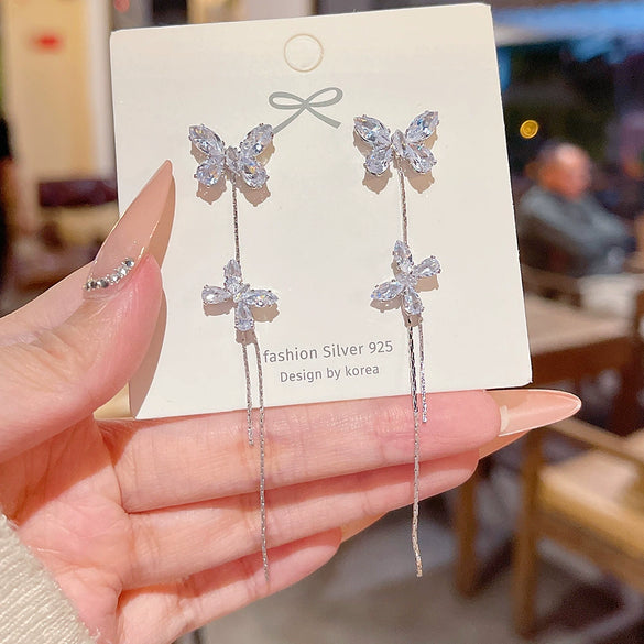 Wholesale Women's Light Luxury Ultraflash Long Copper Zircon Butterfly Tassel Earrings With Bow And Geometric Patterns And Animal Style