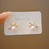 Wholesale Women's Light Luxury Zinc Alloy Rhinestone Bow Pearl Earrings With Electroplating