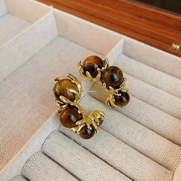 Wholesale Women's Maillard Style Alloy Geometric Tiger Eye Earrings With Electroplating