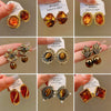 Wholesale Women's Maillard Style Alloy Geometric Tiger Eye Earrings With Electroplating