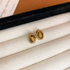 Wholesale Women's Maillard Style Alloy Geometric Tiger Eye Earrings With Electroplating