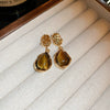 Wholesale Women's Maillard Style Alloy Geometric Tiger Eye Earrings With Electroplating