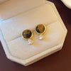Wholesale Women's Maillard Style Alloy Geometric Tiger Eye Earrings With Electroplating