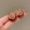 Wholesale Women's Maillard Style Alloy Geometric Tiger Eye Earrings With Electroplating