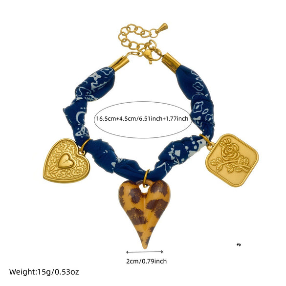 Wholesale Women's Maillard Style Dark Blue Leopard Print Stainless Steel Goldplated Heartshaped Embossed Pendant Bracelet