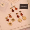 Wholesale Women's Maillard Style Geometric Tiger Eye Real Gold Plated Titanium Steel Earrings
