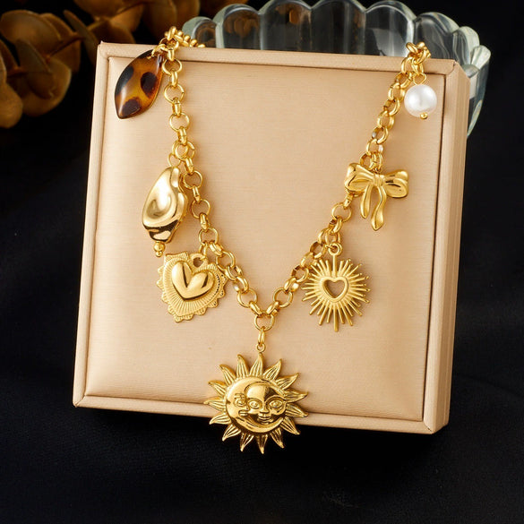 Wholesale Women's Medieval Style Goldplated Stainless Steel Sun Face Heartshaped Bow Tie Pendant Necklace With O Word Chain