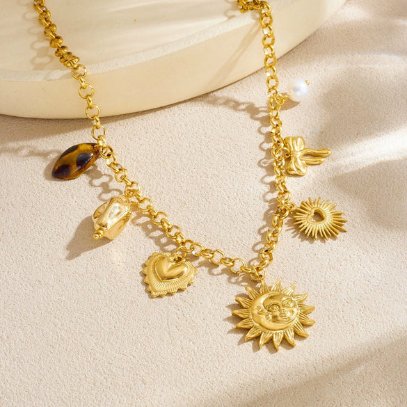 Wholesale Women's Medieval Style Goldplated Stainless Steel Sun Face Heartshaped Bow Tie Pendant Necklace With O Word Chain