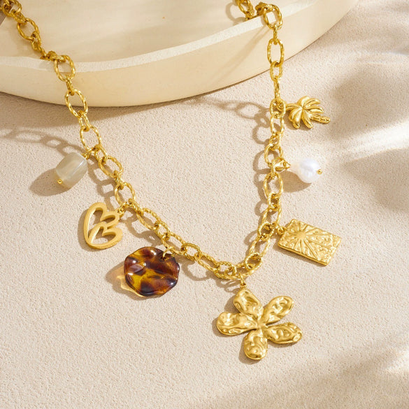 Wholesale Women's Medieval Style Stainless Steel Necklace With Gold Plated Flower Leopard Print Heart And Square Hollow Pendant And Flash O Chain