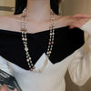 Wholesale Women's Metal And Imitation Pearl Sweater Chain Necklace With Flower Pattern And Light Luxury Style Set With Pearls