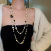 Wholesale Women's Metal And Imitation Pearl Sweater Chain Necklace With Flower Pattern And Light Luxury Style Set With Pearls