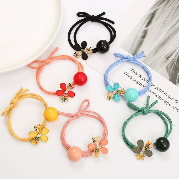 Wholesale Women's Metal Hair Rubber Band With Camellia Design And Electroplating Treatment