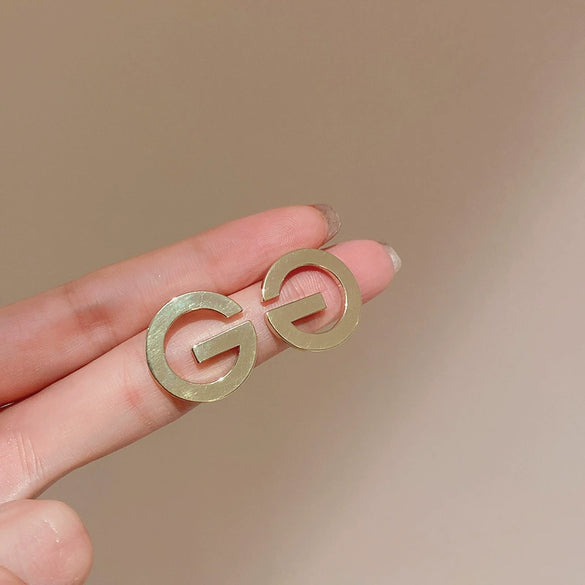 Wholesale Women's Metal Letter Earrings With 925 Silver Needles And Electroplating Simple Style
