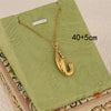 Wholesale Women's Minimalist Geometric 18K Gold Plated Stainless Steel Cross Chain With 3D Ocean Shark Pendant Necklace