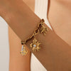 Wholesale Women's Multielement Retro Goldplated Stainless Steel Bracelet With Flower And Butterfly Pendant In Maillard Style