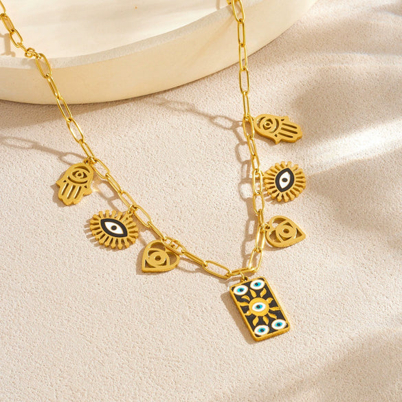 Wholesale Women's Personality Trend Goldplated Stainless Steel Heart Water Drop Bell Pattern Cut Out Pendant Jewelry Set With Cross Chain