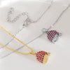 Wholesale Women's Red Zircon Inlaid Copper Goldplated Christmas Hat Pendant Necklace With O Word Chain