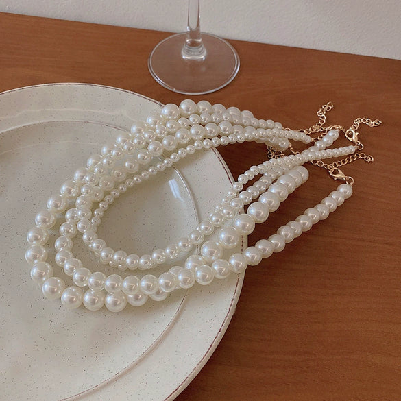 Wholesale Women's Retro French Imitation Pearl And Copper Geometric Clavicle Chain Necklace With Electroplating