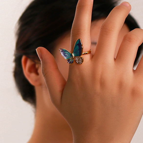Wholesale Women's Retro Light Luxury Ring In Blue Purple Oil Drop With Diamond Butterfly Design Made Of Stainless Steel With 18K Furnace Vacuum Plating