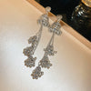 Wholesale Women's Retro Metal Geometric Tassel Earrings With Electroplating Design