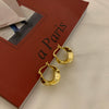 Wholesale Women's S925 Sterling Silver And Copper Irregular Earrings With Leaf Pattern And Simple Metal Design Ear Buckle