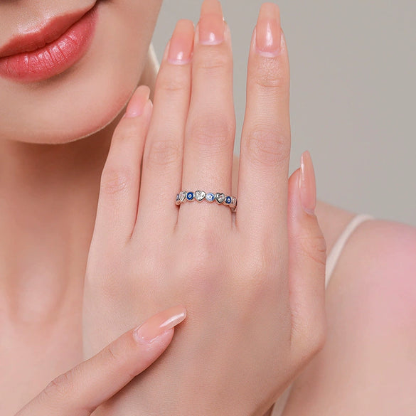 Wholesale Women's S925 Sterling Silver Heartshaped Blue Eye Zircon Ring With Dripping Glue Design