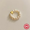 Wholesale Women's S925 Sterling Silver Love Shape Elastic Pearl Ring With Electroplating Design