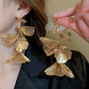 Wholesale Women's Silver Needle Hollow Flower Tassel Earrings With Real Gold Electroplating Zircon Star Pattern