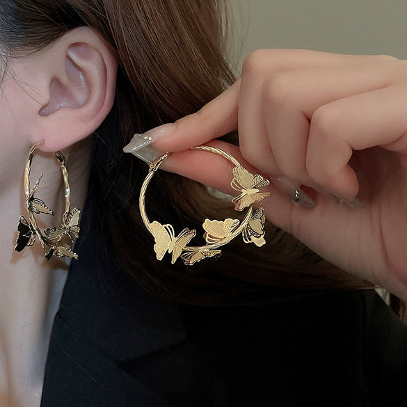 Wholesale Women's Silver Needle Hollow Flower Tassel Earrings With Real Gold Electroplating Zircon Star Pattern