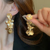 Wholesale Women's Silver Needle Hollow Flower Tassel Earrings With Real Gold Electroplating Zircon Star Pattern