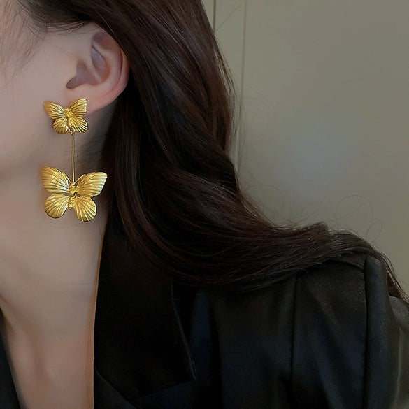 Wholesale Women's Silver Needle Hollow Flower Tassel Earrings With Real Gold Electroplating Zircon Star Pattern