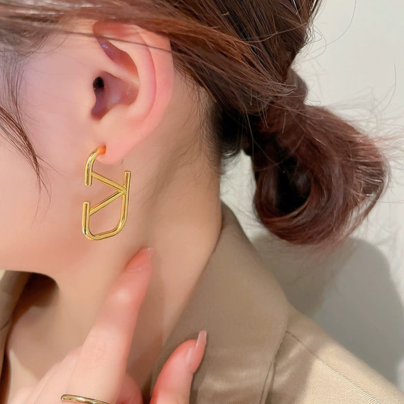Wholesale Women's Silver Needle Hollow Flower Tassel Earrings With Real Gold Electroplating Zircon Star Pattern