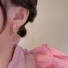 Wholesale Women's 925 Silver Needle Retro Cat's Eye Geometric Earrings With Electroplating Treatment