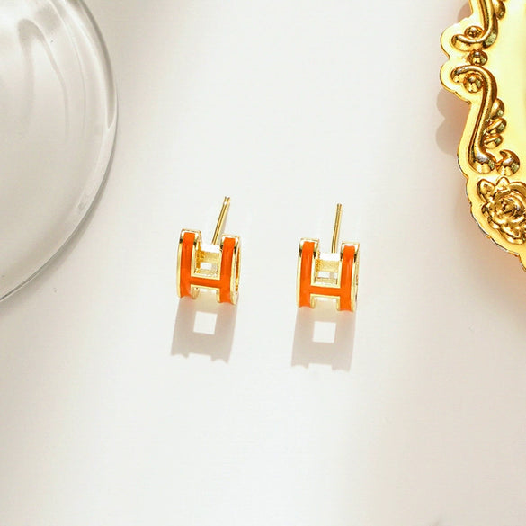 Wholesale Women's Silverplated Copper Oildrip Letter Earrings With Electroplating Process